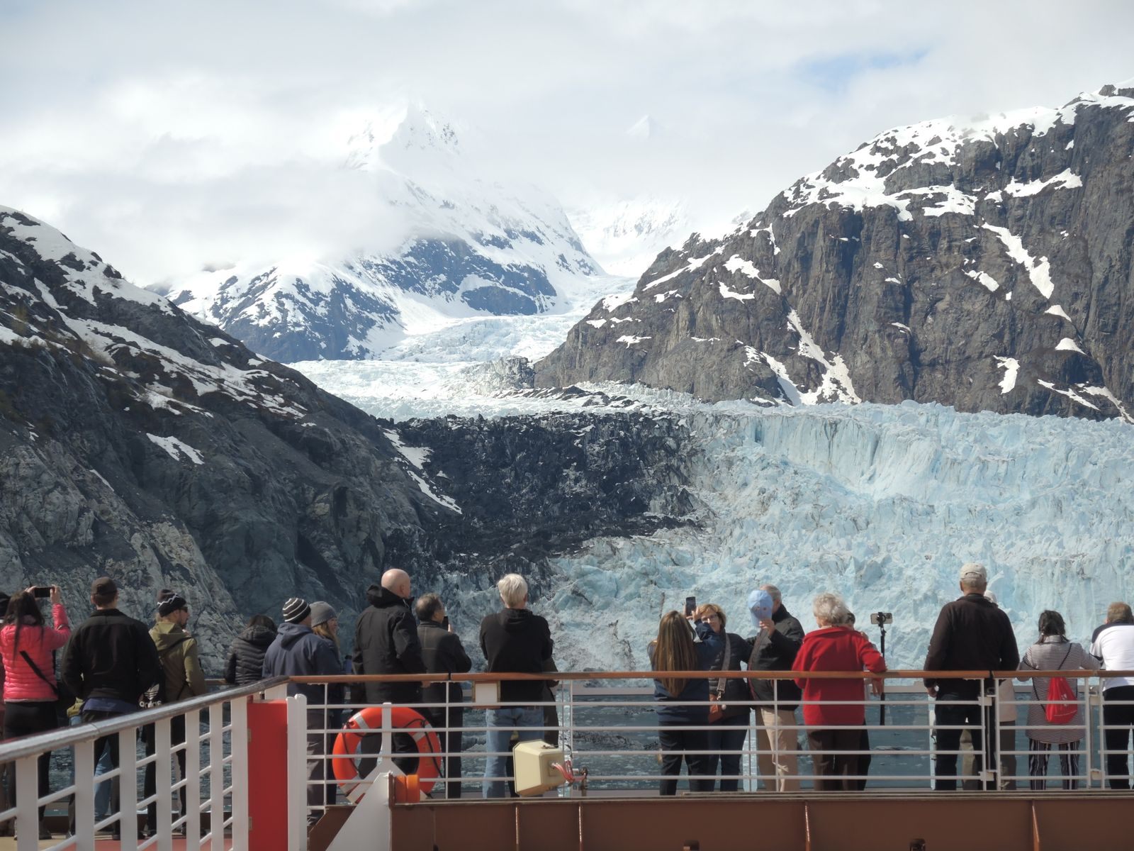 Guests on deck watching a glacier